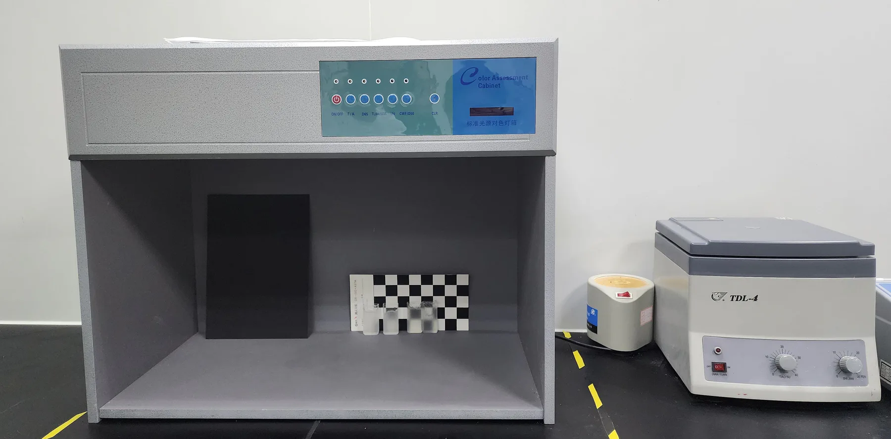 Colour assessment cabinet and centrifuge in a cosmetic application laboratory